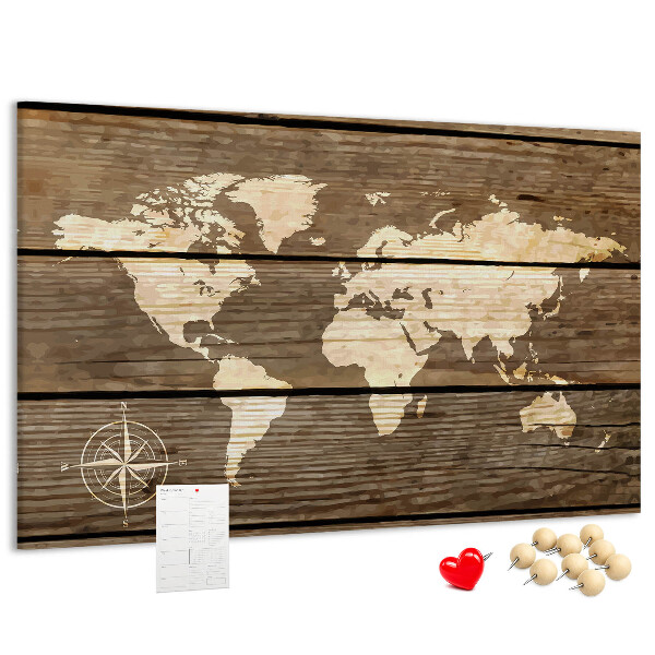 Tableau en liège Une carte du monde sur un fond de planches de bois