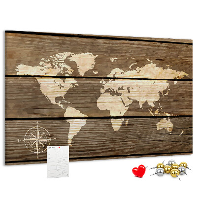 Tableau en liège Une carte du monde sur un fond de planches de bois