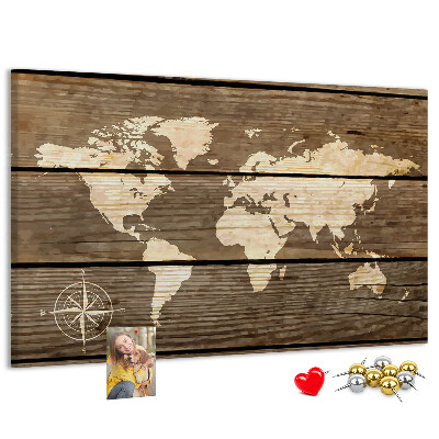 Tableau en liège Une carte du monde sur un fond de planches de bois