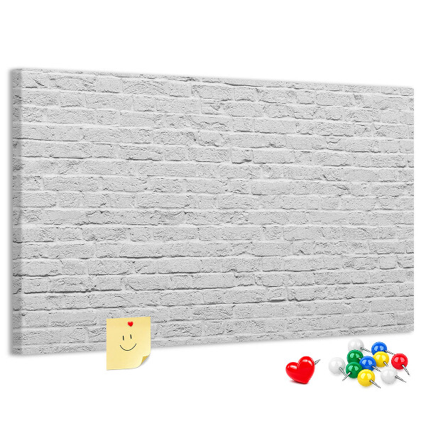 Tableau de liège Mur de briques blanches orné de punaises colorées