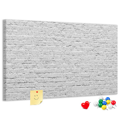 Tableau de liège Mur de briques blanches orné de punaises colorées