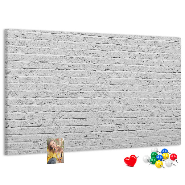 Tableau de liège Mur de briques blanches orné de punaises colorées