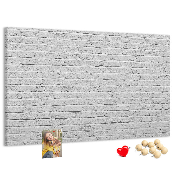 Tableau de liège Mur de briques blanches orné de punaises colorées
