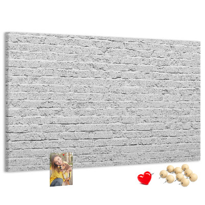 Tableau de liège Mur de briques blanches orné de punaises colorées