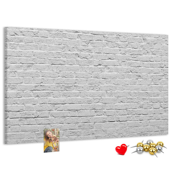 Tableau de liège Mur de briques blanches orné de punaises colorées