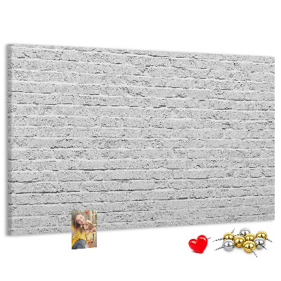 Tableau de liège Mur de briques blanches orné de punaises colorées