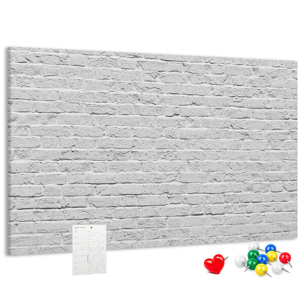 Tableau de liège Mur de briques blanches orné de punaises colorées