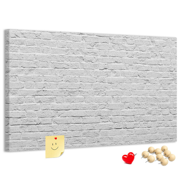 Tableau de liège Mur de briques blanches orné de punaises colorées