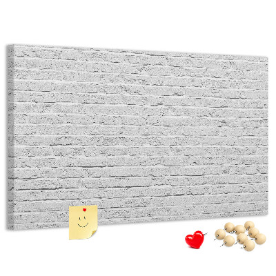 Tableau de liège Mur de briques blanches orné de punaises colorées