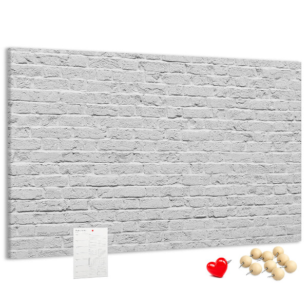 Tableau de liège Mur de briques blanches orné de punaises colorées