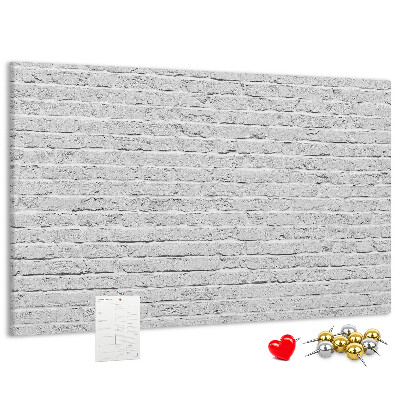 Tableau de liège Mur de briques blanches orné de punaises colorées