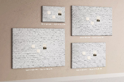 Tableau de liège Mur de briques blanches orné de punaises colorées