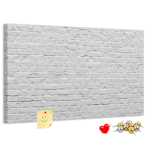 Tableau de liège Mur de briques blanches orné de punaises colorées