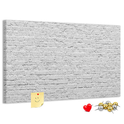 Tableau de liège Mur de briques blanches orné de punaises colorées