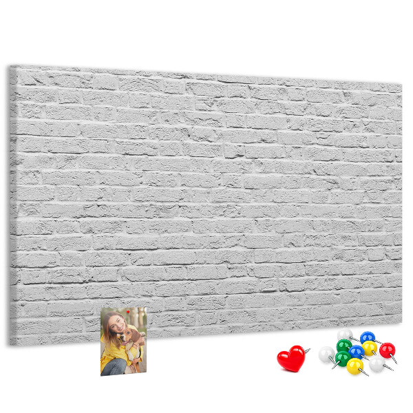 Tableau de liège Mur de briques blanches orné de punaises colorées