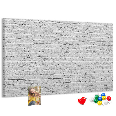 Tableau de liège Mur de briques blanches orné de punaises colorées
