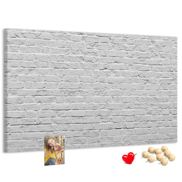 Tableau de liège Mur de briques blanches orné de punaises colorées