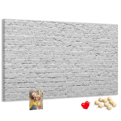 Tableau de liège Mur de briques blanches orné de punaises colorées