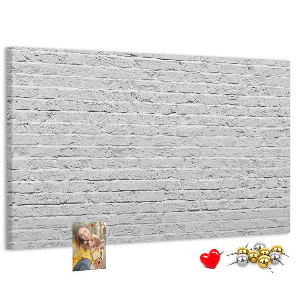 Tableau de liège Mur de briques blanches orné de punaises colorées