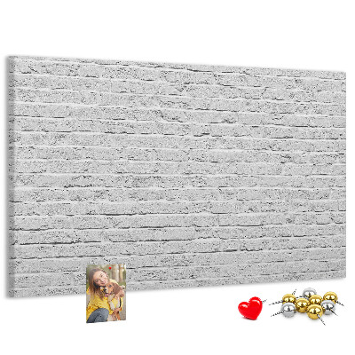 Tableau de liège Mur de briques blanches orné de punaises colorées