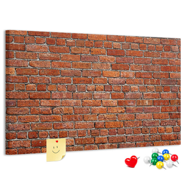 Tableau de liège Mur de briques aux teintes chaudes.