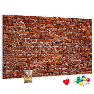 Tableau de liège Mur de briques aux teintes chaudes.