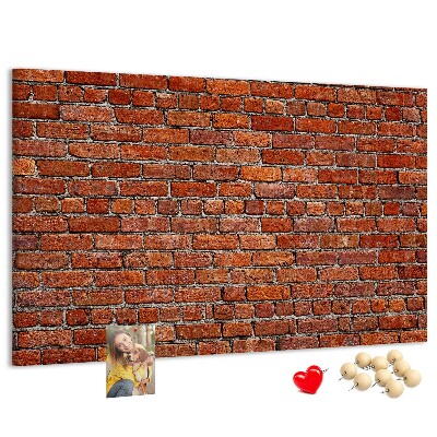 Tableau de liège Mur de briques aux teintes chaudes.