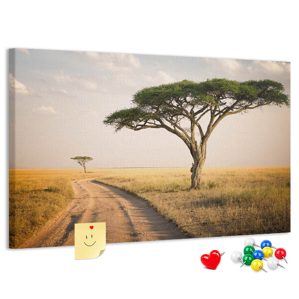 Tableau en liège Une route traversant un paysage africain avec un arbre