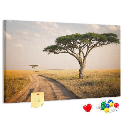 Tableau en liège Une route traversant un paysage africain avec un arbre