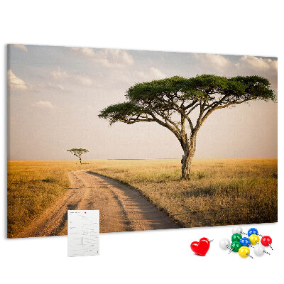 Tableau en liège Une route traversant un paysage africain avec un arbre