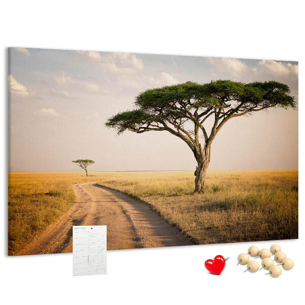 Tableau en liège Une route traversant un paysage africain avec un arbre