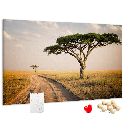 Tableau en liège Une route traversant un paysage africain avec un arbre