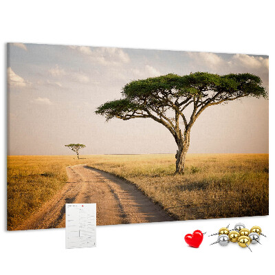 Tableau en liège Une route traversant un paysage africain avec un arbre