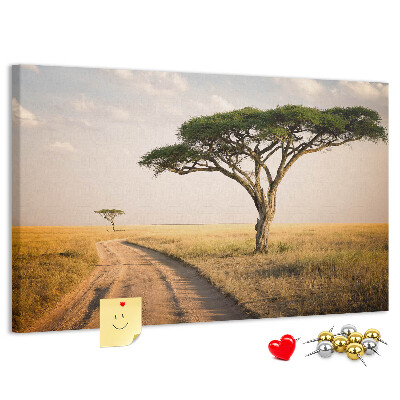 Tableau en liège Une route traversant un paysage africain avec un arbre