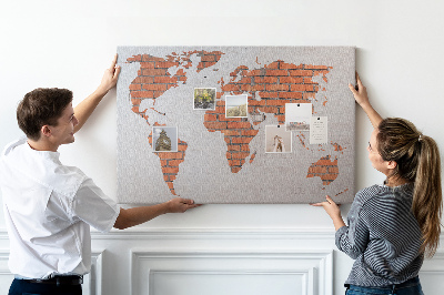 Tableau affichage liège Une carte du monde contre un mur de briques