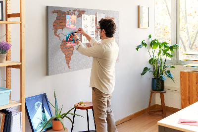 Tableau affichage liège Une carte du monde contre un mur de briques